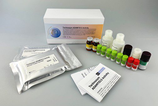 Technoxym ADAMTS13 Activity assay kit with reagent bottles, test vials, and instruction inserts laid out on a table.